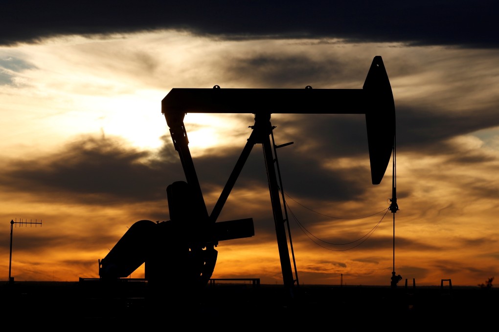 The sun sets behind a crude oil pump in Texas. The Bank of China effectively set up an oil derivatives trading platform for lay investors to trade futures contracts on the West Texas Intermediate, one of the main gauges of crude prices. Photo: Reuters