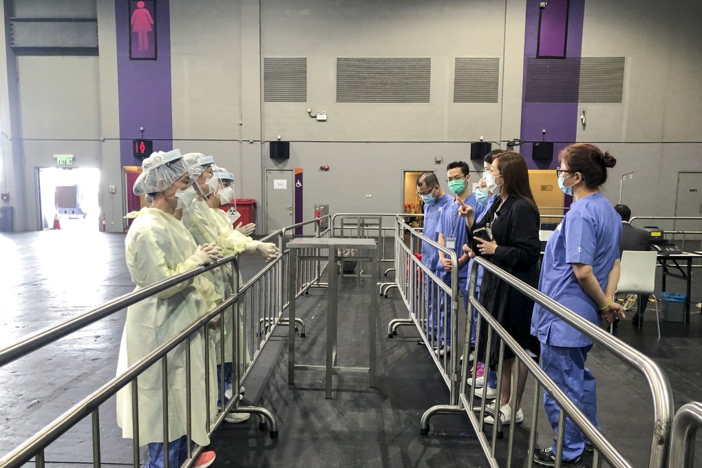 Staff working in different areas at the expo testing facility were separated by barriers. Photo: Handout