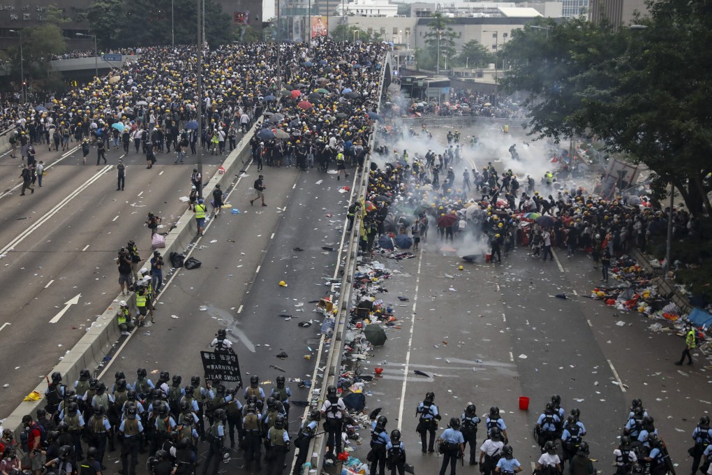 Police fire tear gas at protesters during clashes in Admiralty on June 12. Photo: K.Y. Cheng