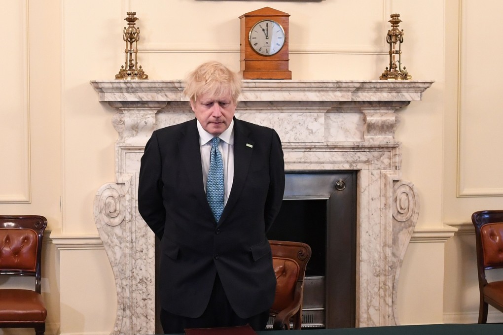 Britain's Prime Minister Boris Johnson pauses for a minute's silence to honour key workers, including NHS staff. Photo: AFP