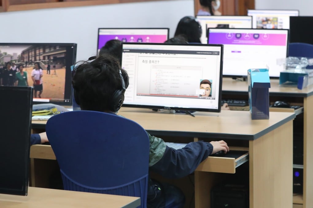 Students join an online class while maintaining social distancing at an elementary school in Suwon, South Korea. Photo: EPA