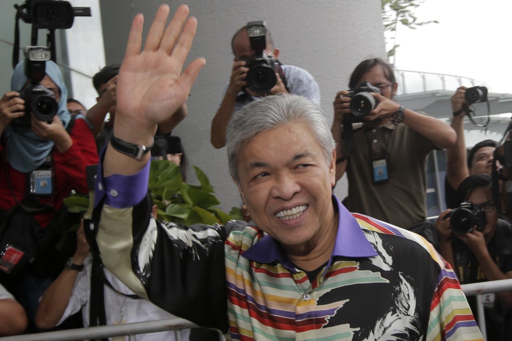 Former Malaysian deputy prime minister Zahid Hamidi waves to media in Putrajaya in 2018. His daughter and son-in-law have been fined for contravening Malaysia’s Covid-19 movement control order. Photo: EPA-EFE