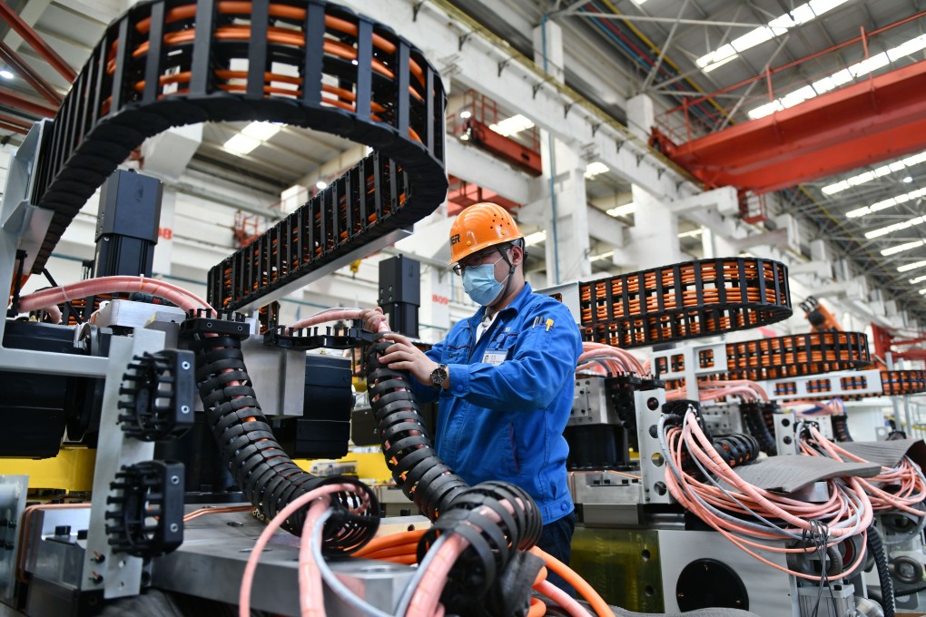 A worker assembles automation equipment at a Jier Machine-Tool Group plant in Jinan, east China’s Shandong province, on March 31. Photo: Xinhua