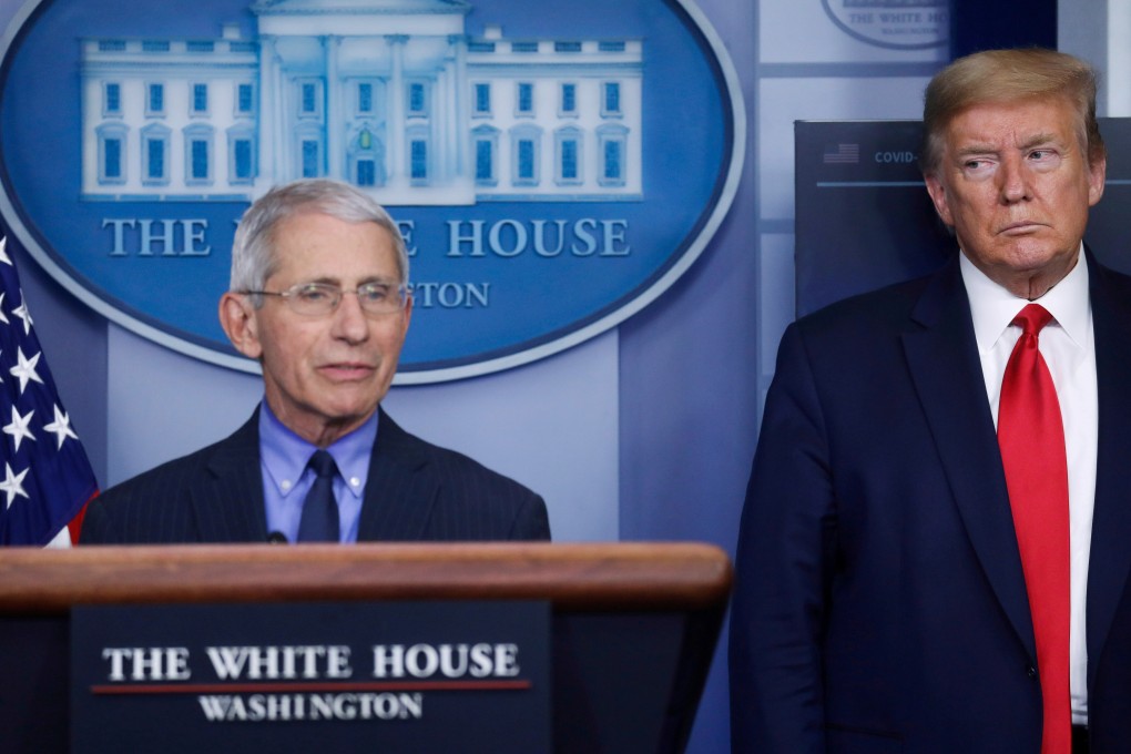 US National Institute of Allergy and Infectious Diseases Director Anthony Fauci answers questions, as President Donald Trump looks on, at a coronavirus task force briefing at the White House. Photo: Reuters