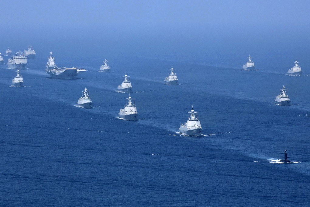 The Liaoning aircraft carrier takes part in drills in the South China Sea. A Chinese military strategist said taking back Taiwan should not be a top priority. Photo: AP