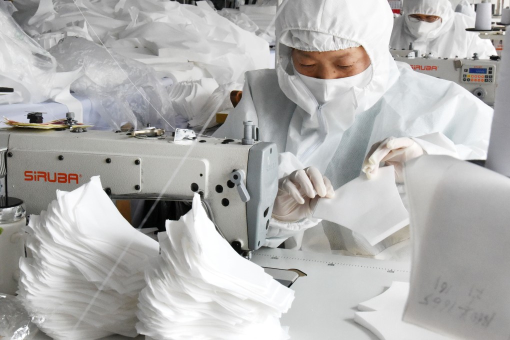 Workers make face masks at the workshop of a garment company which has changed its production line to produce protective materials in Qingdao, Shandong province. Photo: Xinhua