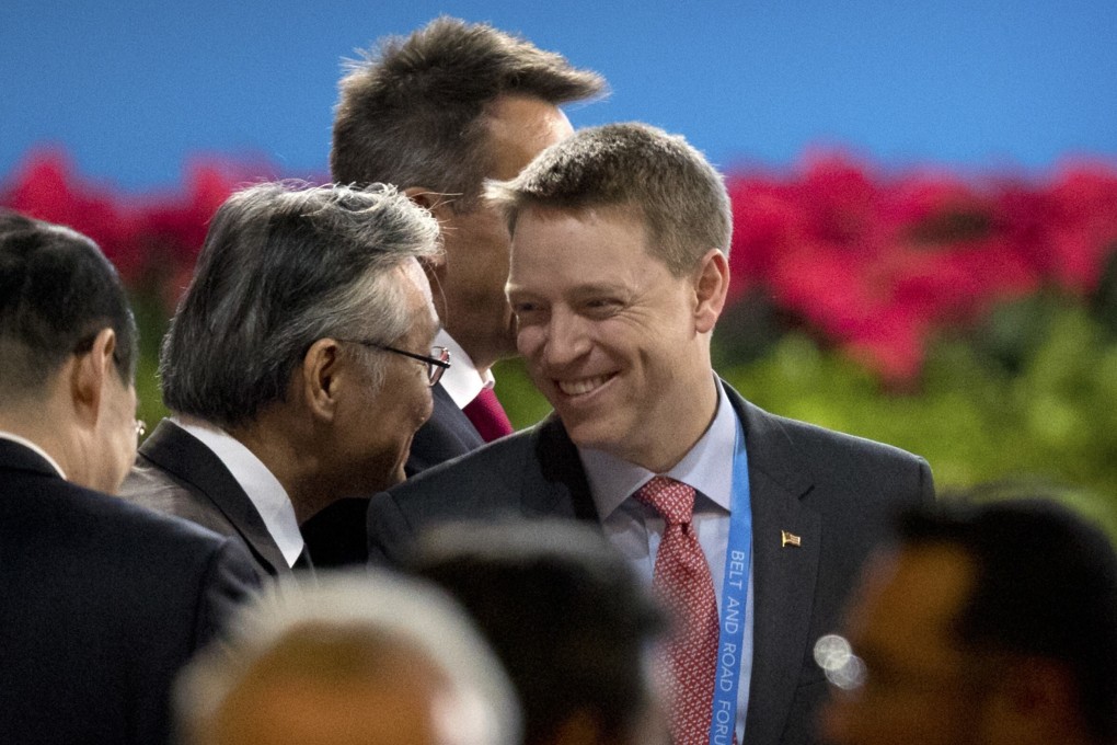 The tone of the speech by Pottinger (centre) contrasted with the often blunt approach of Donald Trump. Photo: AP