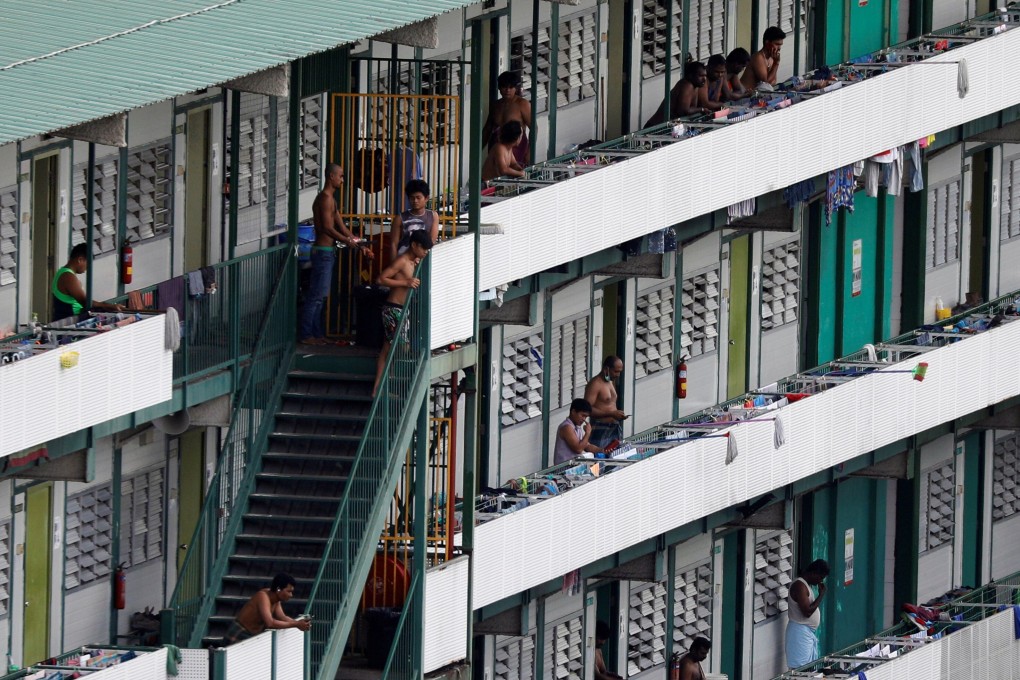 Migrant workers outside their dormitory rooms at Cochrane Lodge II on April 16. Photo: Reuters