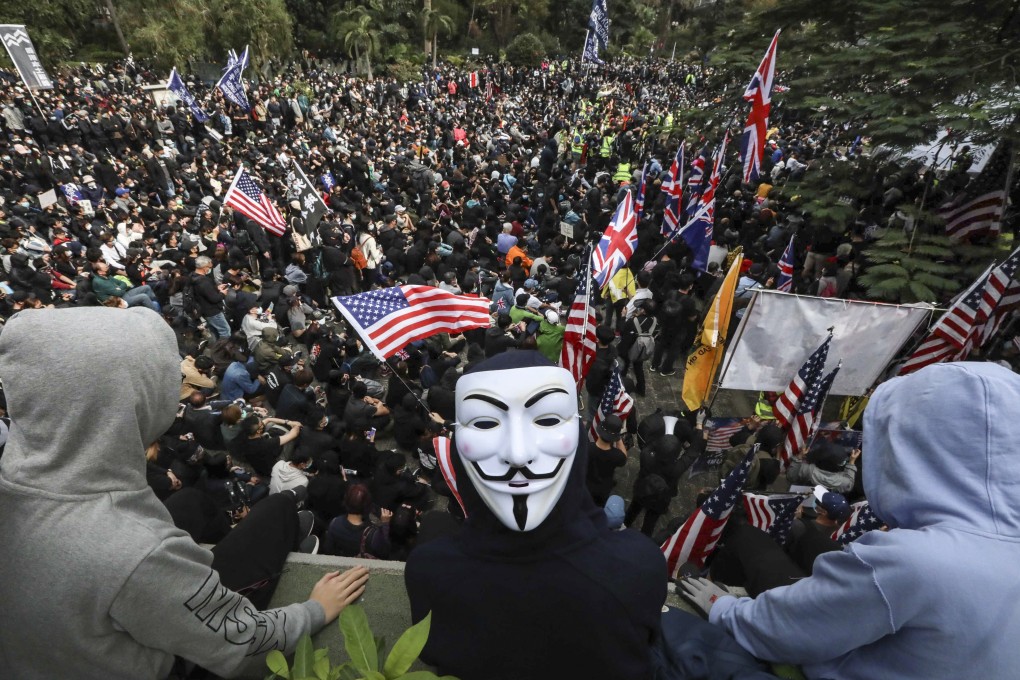Anti-government protesters fly US and British flags at Charter Garden in Central. Photo: Felix Wong