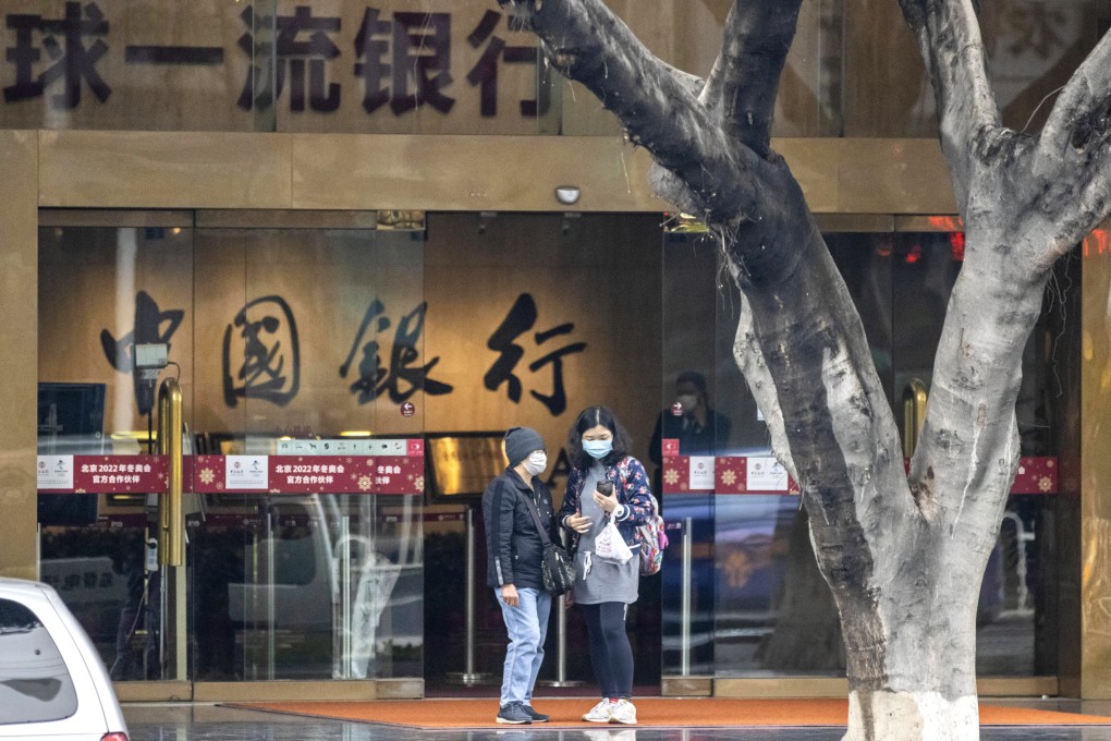 Investors who bought Bank of China’s oil derivatives product gather to protest in front of the bank’s main building in Guangzhou on April 24. Photo: EPA-EFE