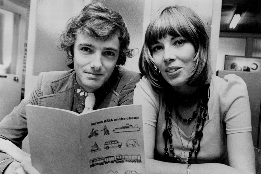 Co-founders of Lonely Planet travel guide Tony Wheeler and his wife Maureen, with their book Across Asia on the Cheap in November 1973. Photo: Getty Images