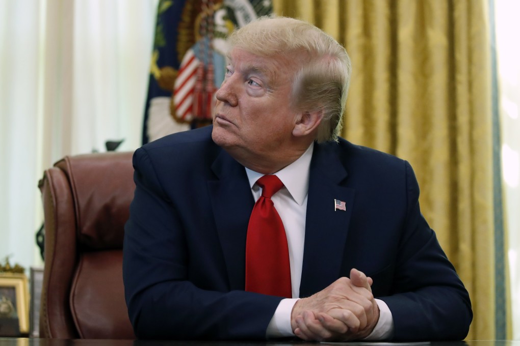 US President Donald Trump attends a meeting in the Oval Office on Friday. Photo: AP