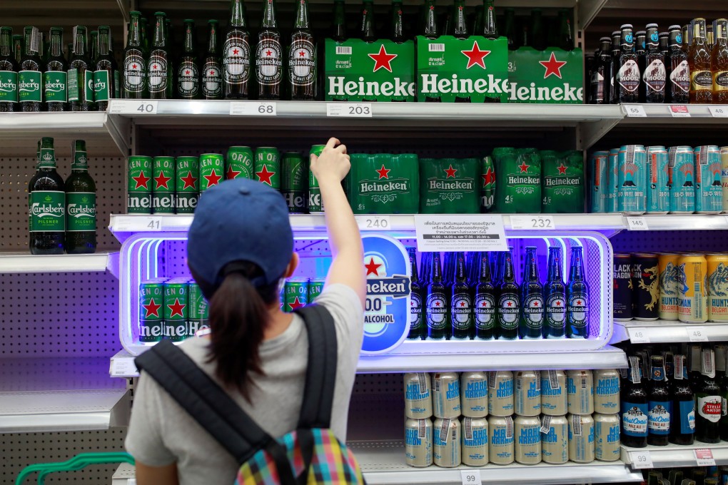 A woman buys beer in a Bangkok supermarket after the government lifted a ban on alcohol sales that had been in place since April 10. Photo: Reuters