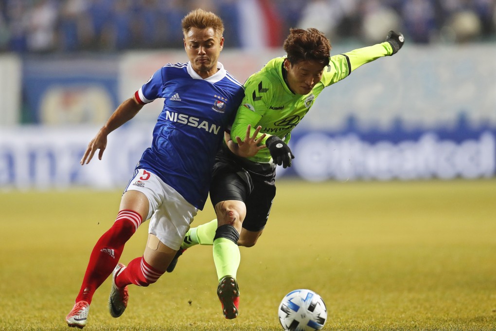 South Korea’s Jeonbuk Hyundai Motors and Japan’s Yokohama F Marinos in action at the Jeonju World Cup Stadium in the 2020 AFC Champions League. Photo: EPA