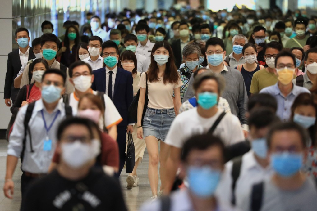 A crowd of morning commuters wearing face masks at the Central MTR station in Central, amid the coronavirus pandemic. Photo: May Tse