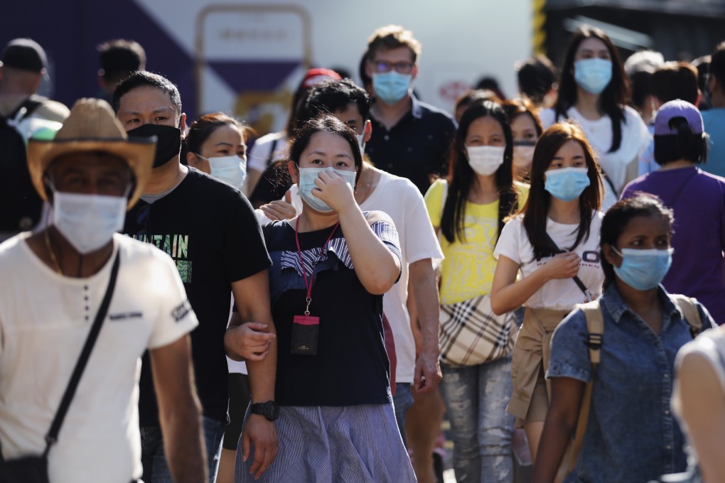 Hongkongers don surgical masks on the streets, amid the coronavirus pandemic. Photo: Winson Wong