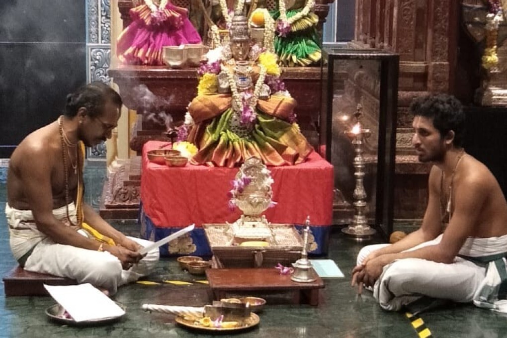 Priests at Sri Krishnan Temple conduct prayers for devotees who are at home. Photo: Sri Krishnan Temple