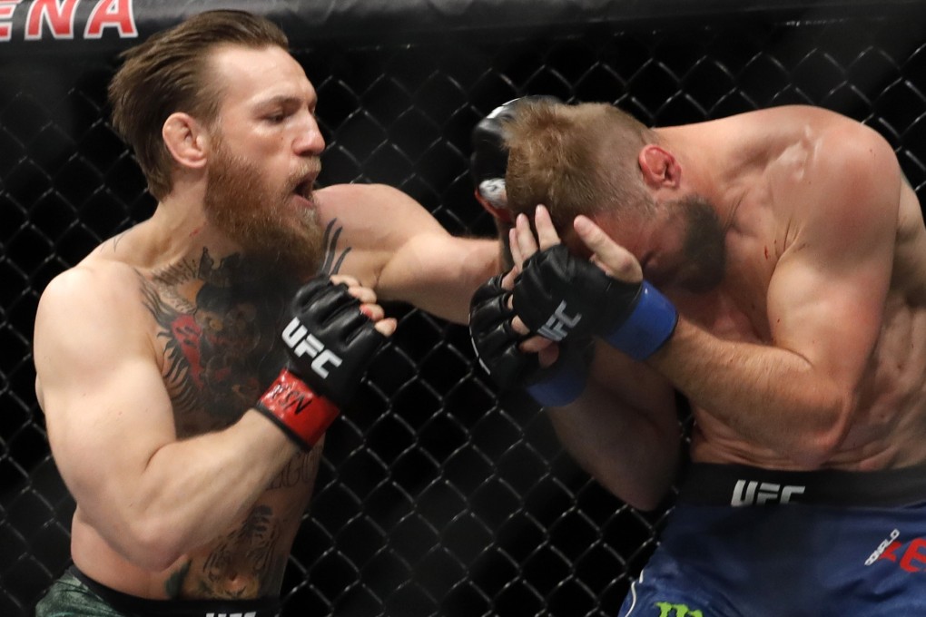 Conor McGregor punches Donald Cerrone in their welterweight bout at UFC 246 in January. Photo: AFP