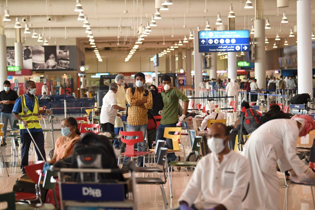Indian nationals arrive at Dubai International Airport as the first wave of the Hail India evacuation gets under way. Photo: AFP