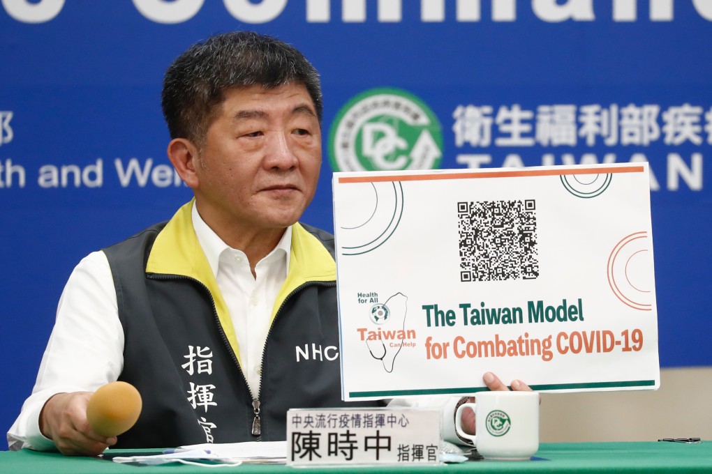 Taiwan’s Minister of Health and Welfare Chen Shih-chung displays a QR code promoting ‘The Taiwan Model for Combating Covid-19’. Photo: EPA