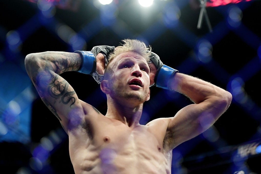 TJ Dillashaw looks dejected after the referee stops his fight against Henry Cejudo. Photo: AFP