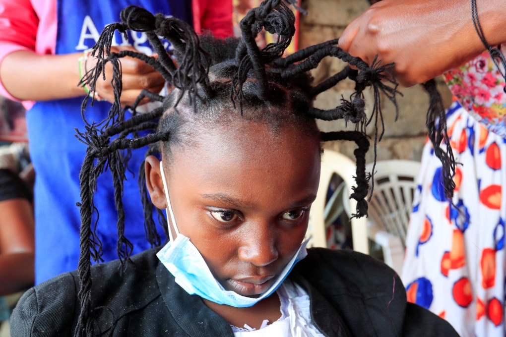Martha Apisa, 12, gets the coronavirus hairstyle at Mama Brayo Beauty Salon in Kibera, in Nairobi, Kenya. Photo: Reuters