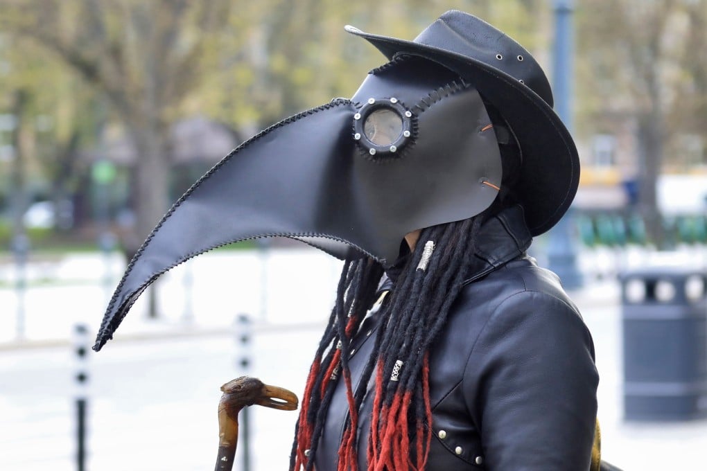Artist Severija Bruzaite wears a mask designed by Donatas Dubauskas as she takes part in Mask Fashion Week in Vilnius, Lithuania. Artists encouraged residents to have fun wearing the now-mandatory facial accessory. Photo: AFP