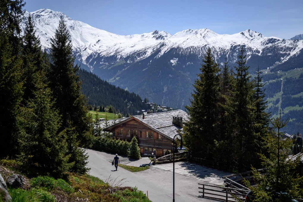 A passer-by walks past a wooden chalet in Verbier owned Britain's Prince Andrew on Thursday. Photo: AFP