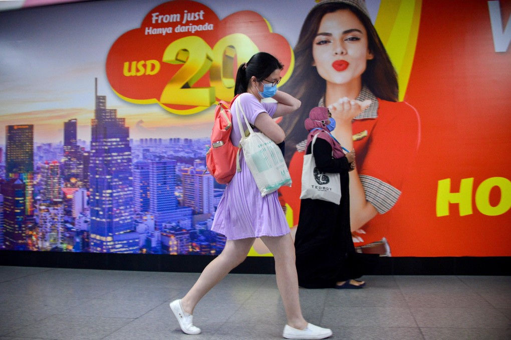 A woman leaves a Light Rail Transit station in Kuala Lumpur, Malaysia. Photo: Xinhua
