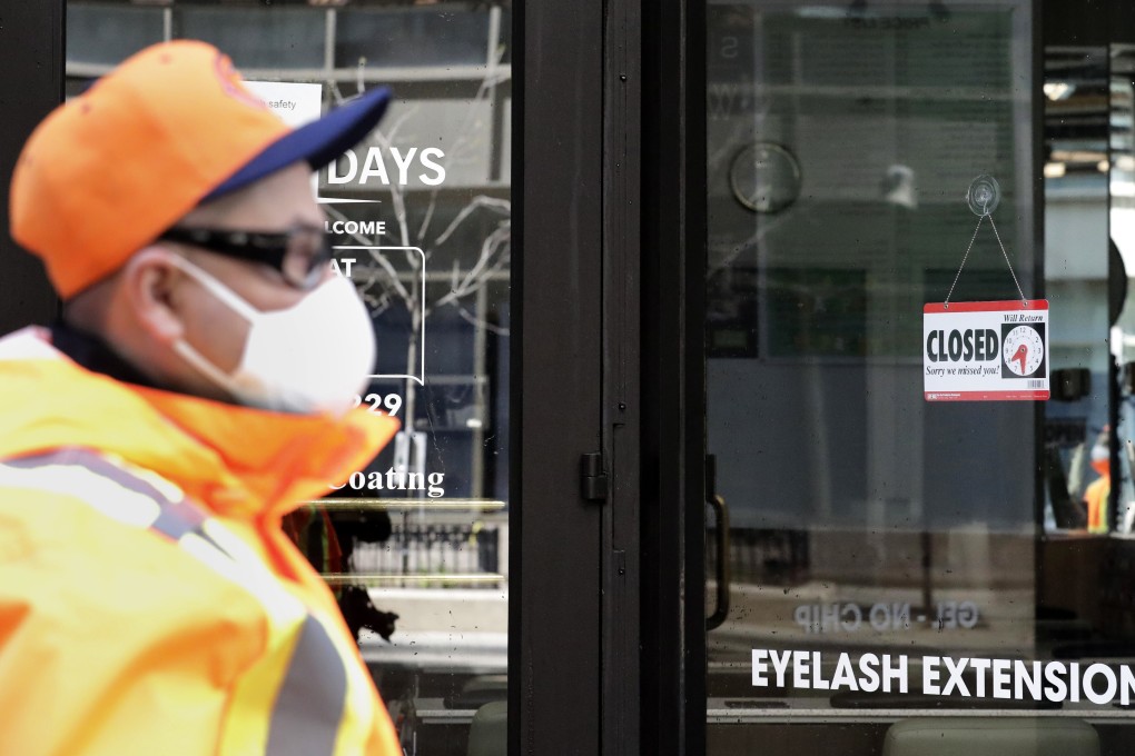 A “closed” sign at a Fashion Nails shop in downtown Chicago. Photo: AP Photo