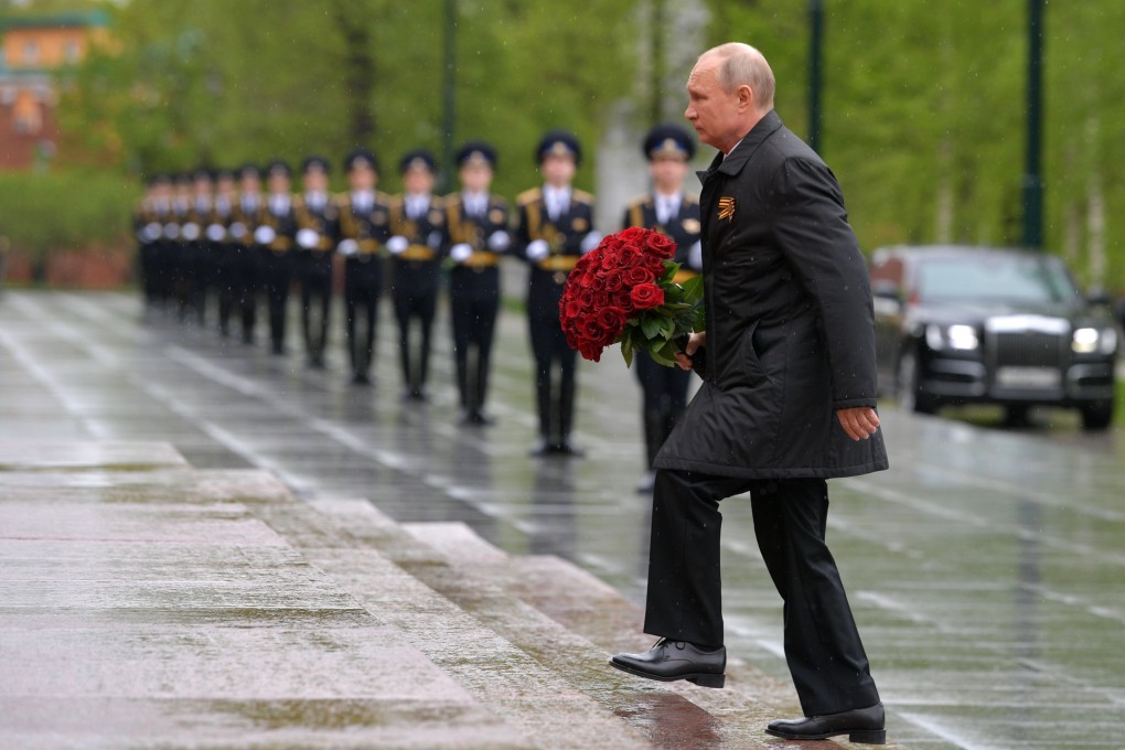 Russian President Vladimir Putin attends a flower-laying ceremony at the Tomb of the Unknown Soldier memorial near the Kremlin wall in Moscow. Photo: AFP