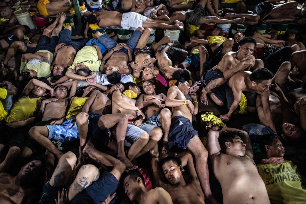 Inmates sleep inside the Quezon City Jail in Manila, in this 2016 photo. Photo: AFP