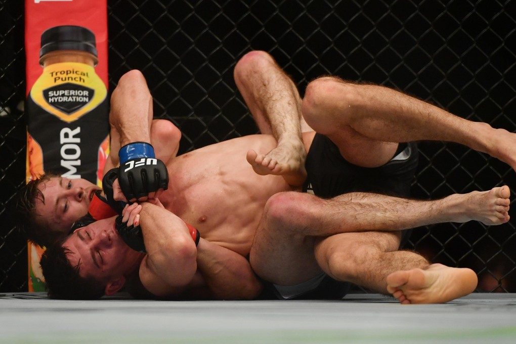 Bryce Mitchell tries to choke Charles Rosa at UFC 249. Photos: USA TODAY Sports