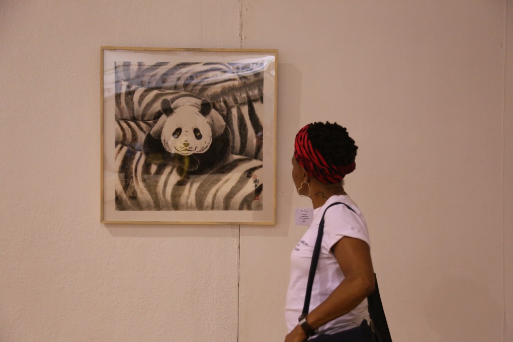 A visitor views an artwork at the second Belt and Road Afro-Sino Art Exchange Exhibition at the National Gallery of Zimbabwe in Harare, Zimbabwe, on April 29, 2019. African nations have borrowed heavily from China in recent years. Photo: Xinhua