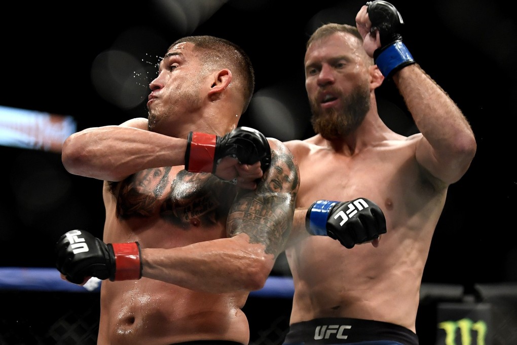 Anthony Pettis attempts to strike Donald Cerrone in their welterweight fight at UFC 249. Photos: AFP