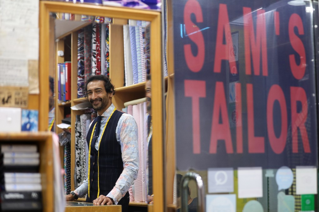 Roshan Melwani, manager of Sam’s Tailor in Tsim Sha Tsui, has seen business slow down because of the coronavirus pandemic. Photo: Winson Wong