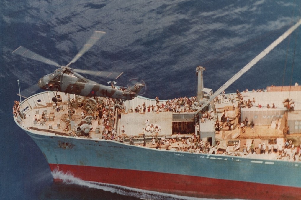 A British RAF helicopter from Hong Kong moves over Danish cargo ship the Clara Maersk to start an airlift on May 2, 1975. Four people, including a sick baby, required urgent air pick up from the ship carrying over 3,000 Vietnamese refugees.