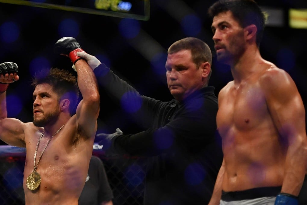 Henry Cejudo’s arm is raised by referee Keith Peterson after defeating Dominick Cruz at UFC 249. Photo: USA TODAY Sports