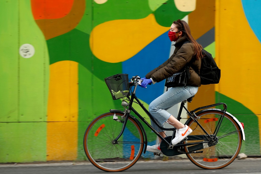 A cyclist wears a protective mask in Brussels, Belgium. Photo: Reuters