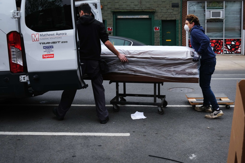 Workers load a casket into a van in Brooklyn in New York City. The US has more than 1.3 million confirmed cases of the coronavirus, of whom roughly 80,000 have died. Photo: AFP