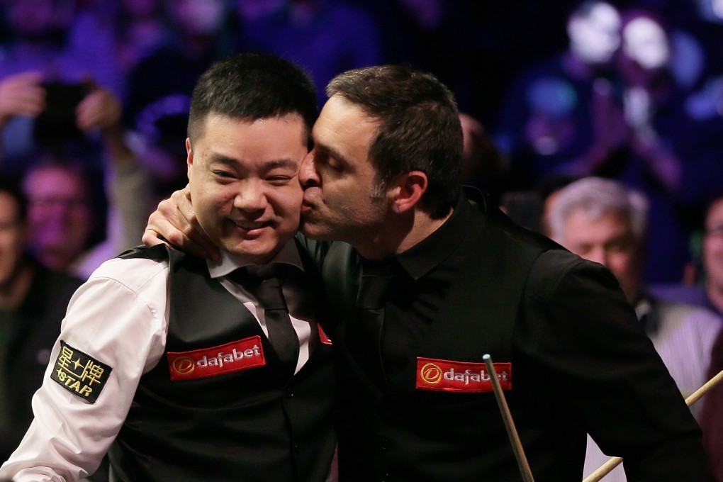 Ronnie O’Sullivan kisses Ding Junhui after their semi-final at the 2019 Masters in London. O’Sullivan pulled out of the 2020 tournament. Photo: Xinhua