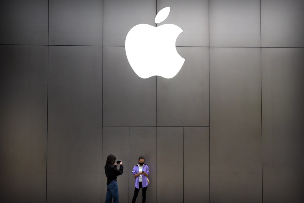 Women wear face masks to protect against the spread of the new coronavirus as they stand near an Apple store in Beijing, Friday, April 24, 2020. China reported no new virus deaths for the ninth straight day, and just six new cases on Friday. (AP Photo/Mark Schiefelbein)