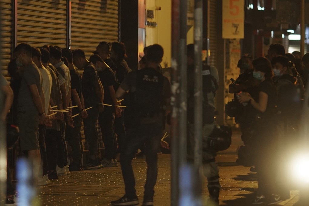 Sunday’s mass arrest of anti-government protesters was the largest in months. (AP Photo/Vincent Yu)