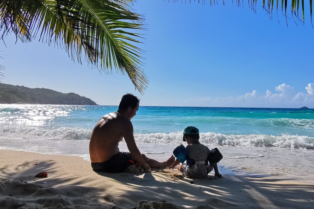 Beijinger Rex Yang (left) and his nephew George Yang enjoy some time together on the beach in the Seychelles in the Indian Ocean. The family arrived in January, intending to stay two weeks, but are stuck there.
