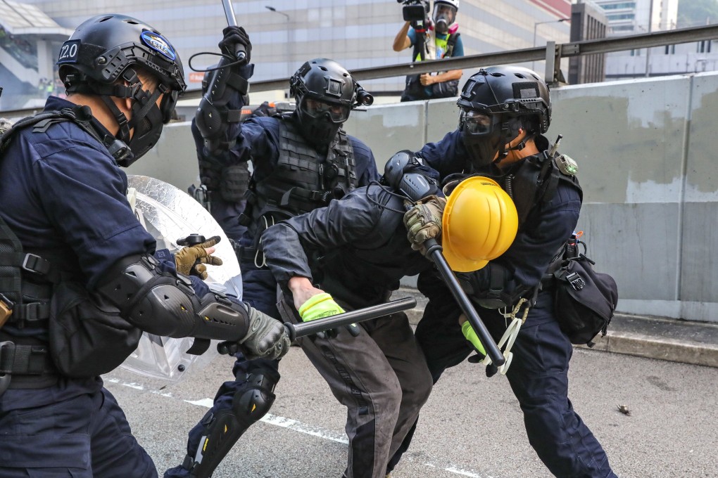 Hong Kong riot police arrest protesters following clashes during an anti-extradition bill march in September. Photo: K.Y. Cheng