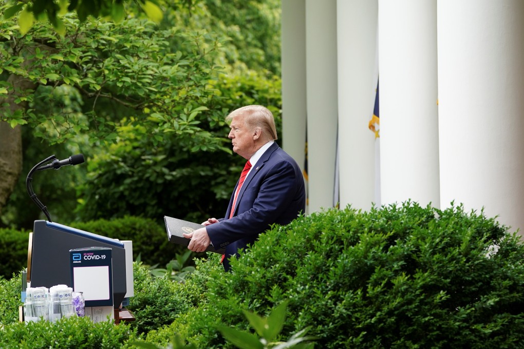 US President Donald Trump arrives to address a coronavirus press briefing in the Rose Garden at the White House on Monday. Photo: Reuters