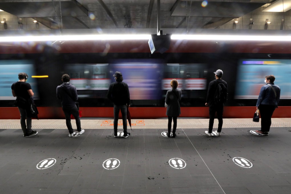 People stand on signs to respect social distancing on a tram platform in Nice, France. Photo: Reuters