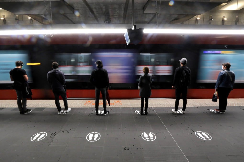People stand on signs to respect social distancing on a tram platform in Nice, France. Photo: Reuters