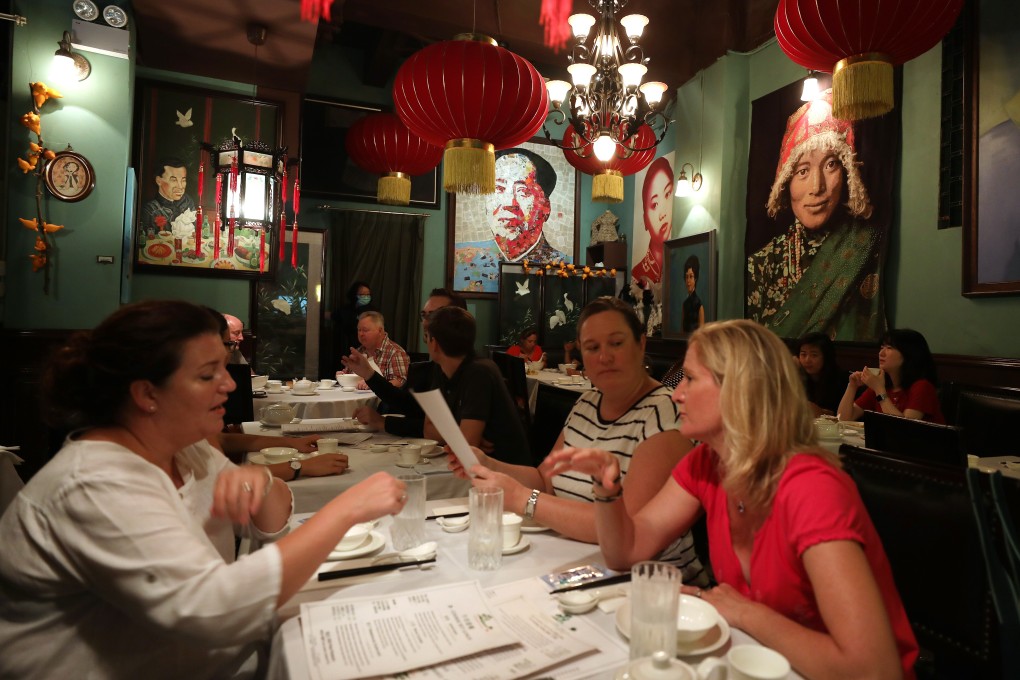 Customers at a restaurant in Central on Friday after the Hong Kong government eased social distancing measures to contain the coronavirus outbreak. Photo: Xiaomei Chen