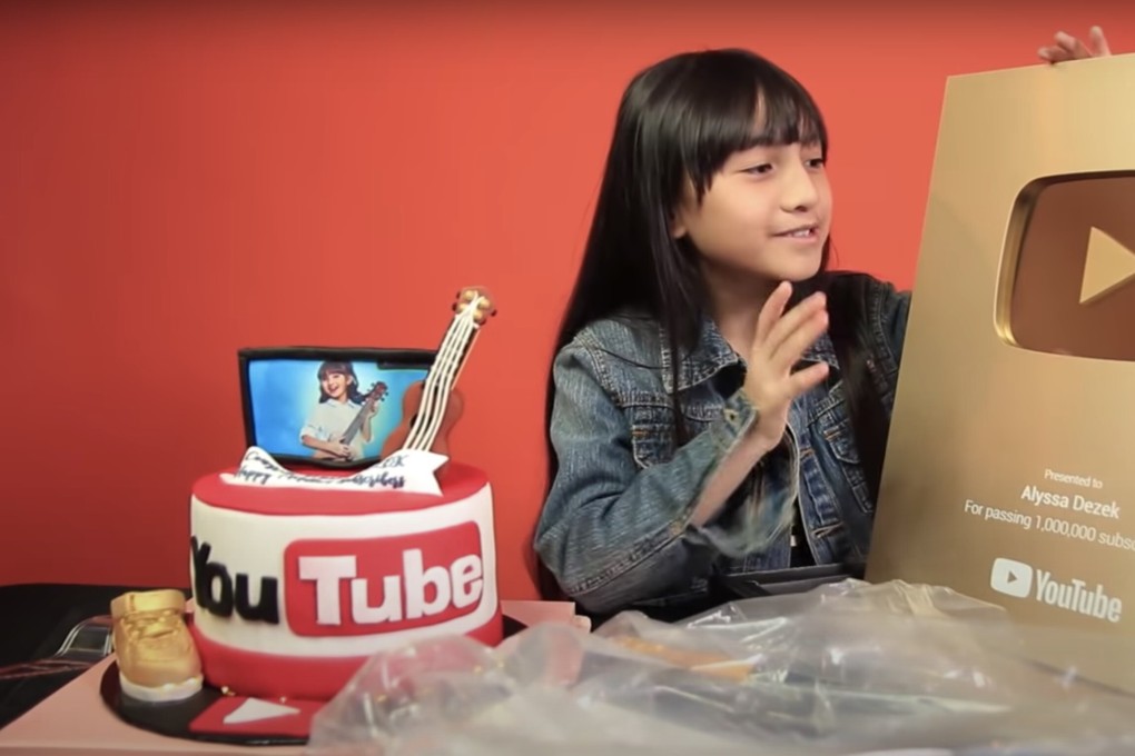 Malaysian YouTube star Alyssa Dezek and her YouTube Gold Play Button.
